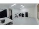 Large basement features a work area, exercise bike, and a door leading outside at 1404 Fairwinds Ct, Loganville, GA 30052
