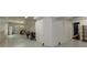 Wide angle panorama of a finished basement with a large storage area and garage access at 1404 Fairwinds Ct, Loganville, GA 30052