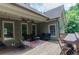 Inviting covered deck with comfortable seating, perfect for outdoor entertaining and relaxation at 1404 Fairwinds Ct, Loganville, GA 30052