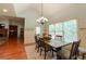 Bright dining room featuring large windows and stylish lighting fixture at 1404 Fairwinds Ct, Loganville, GA 30052
