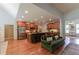 Open-concept living area with a kitchen featuring stainless steel appliances and a cozy living room, perfect for entertaining at 1404 Fairwinds Ct, Loganville, GA 30052