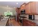Updated kitchen with stainless steel appliances, granite countertops, and ample cabinet space, creating a chef's dream at 1404 Fairwinds Ct, Loganville, GA 30052