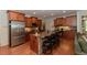 Modern kitchen island with barstool seating, stainless steel appliances, and granite countertops, perfect for casual dining at 1404 Fairwinds Ct, Loganville, GA 30052