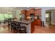 Gourmet kitchen featuring a large island, stainless steel appliances, and plenty of seating for casual meals or gatherings at 1404 Fairwinds Ct, Loganville, GA 30052