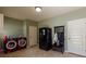Laundry room equipped with red washer and dryer, refrigerator, and convenient storage at 1404 Fairwinds Ct, Loganville, GA 30052