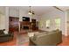 Spacious living room with a stone fireplace, built-in shelving, and ample seating; ideal for Gathering gatherings at 1404 Fairwinds Ct, Loganville, GA 30052