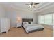 Comfortable main bedroom offers a relaxing retreat with neutral tones and plush bedding at 1404 Fairwinds Ct, Loganville, GA 30052