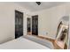 Spacious bedroom featuring wood floors, mirror and black accent doors at 1471 Hardin Dr, College Park, GA 30337