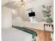 Charming bedroom featuring an overhead television, modern light fixture and leafy decorative tree at 1471 Hardin Dr, College Park, GA 30337