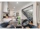 Inviting dining area showcasing a modern staircase, round table, and open layout to the kitchen at 1471 Hardin Dr, College Park, GA 30337
