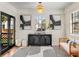 Beautiful entryway with modern black console table, stylish decor, and eye-catching black and white rug at 1471 Hardin Dr, College Park, GA 30337