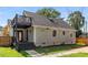 View of the back of the house showing the back porch and spacious back yard at 1471 Hardin Dr, College Park, GA 30337