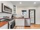 Bright kitchen with stainless steel appliances, wooden countertops, and white subway tile backsplash at 1471 Hardin Dr, College Park, GA 30337