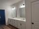 Well-lit bathroom with double sinks, sleek vanities, and contemporary fixtures throughout at 3232 Cyrus Creek Dr, Kennesaw, GA 30152