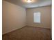Carpeted bedroom with window offering lots of natural light; blank space ready for personalization at 3232 Cyrus Creek Dr, Kennesaw, GA 30152