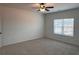 Spacious bedroom features neutral carpet, ceiling fan, and a window offering great natural light at 3232 Cyrus Creek Dr, Kennesaw, GA 30152
