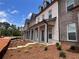 New townhomes with landscaping, featuring brick exteriors and covered entrances at 3232 Cyrus Creek Dr, Kennesaw, GA 30152