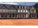 New townhomes with brick exteriors, covered entrances, and dark roofing at 3232 Cyrus Creek Dr, Kennesaw, GA 30152