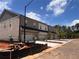 New townhouses featuring attached garages and brick facade details at 3232 Cyrus Creek Dr, Kennesaw, GA 30152