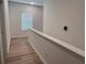 Bright hallway with wood flooring, a window and neutral walls creating a welcoming and airy atmosphere at 3232 Cyrus Creek Dr, Kennesaw, GA 30152