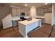 Contemporary kitchen with an island, sleek cabinets, and modern lighting at 3232 Cyrus Creek Dr, Kennesaw, GA 30152
