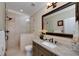 Elegant bathroom features tiled shower, granite countertop, and framed mirror at 825 Chalet Hls, Mcdonough, GA 30253