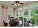 Bright breakfast nook with large windows and a view of the landscaped backyard at 825 Chalet Hls, Mcdonough, GA 30253