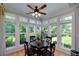 Sun-drenched breakfast nook surrounded by windows with views of the landscaped yard at 825 Chalet Hls, Mcdonough, GA 30253