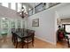 Elegant dining room featuring a large table with seating for eight, chandelier, and access to living areas at 825 Chalet Hls, Mcdonough, GA 30253