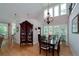 Elegant dining room with large windows, chandelier, and hardwood floors at 825 Chalet Hls, Mcdonough, GA 30253