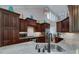 Modern kitchen with stainless steel appliances, granite countertops, and custom cabinetry at 825 Chalet Hls, Mcdonough, GA 30253
