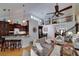 Open concept living room with kitchen, staircase, and hardwood floors at 825 Chalet Hls, Mcdonough, GA 30253