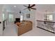 Cozy loft featuring neutral colors, ceiling fans, and ornamental railings at 825 Chalet Hls, Mcdonough, GA 30253