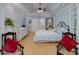 The main bedroom features a tray ceiling, a ceiling fan, and hardwood floors at 825 Chalet Hls, Mcdonough, GA 30253
