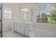 Lovely bathroom with a separate soaking tub and picture window at 5831 Wembley Dr, Douglasville, GA 30135