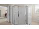 Bathroom showing glass enclosed shower stall, toilet and door to bedroom at 5831 Wembley Dr, Douglasville, GA 30135