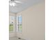 Bright bedroom with neutral walls, large windows, and a ceiling fan at 5831 Wembley Dr, Douglasville, GA 30135
