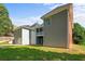 A beautifully landscaped yard surrounds a home with a charming screened porch and convenient garage access at 5831 Wembley Dr, Douglasville, GA 30135