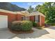 Brick home with a well-maintained lawn and a two car garage at 5831 Wembley Dr, Douglasville, GA 30135