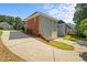 Exterior view of a house with a long driveway and multi-car garage at 5831 Wembley Dr, Douglasville, GA 30135