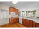 Cozy kitchen featuring stainless appliances, wooden cabinetry, and light countertops at 5831 Wembley Dr, Douglasville, GA 30135