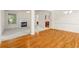 Bright living room with hardwood floors, fireplace, and large windows offering plenty of natural light at 5831 Wembley Dr, Douglasville, GA 30135