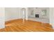 Bright living room featuring hardwood floors, a fireplace, and an open layout at 5831 Wembley Dr, Douglasville, GA 30135