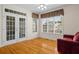 Living room with French doors and a large window at 5831 Wembley Dr, Douglasville, GA 30135