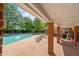 A picturesque pool area offers ample seating and shade, perfect for a relaxing day outdoors at 5831 Wembley Dr, Douglasville, GA 30135