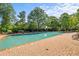 A refreshing community pool is surrounded by ample seating and lush greenery for relaxation and enjoyment at 5831 Wembley Dr, Douglasville, GA 30135