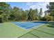 A community tennis court offers residents a recreational space for sports and active lifestyles amid lush greenery at 5831 Wembley Dr, Douglasville, GA 30135