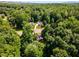 An aerial view of a home surrounded by lush greenery at 6280 Autry Mill Rd, Cumming, GA 30028