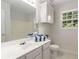Bathroom with bright vanity, cabinet, mirror, shower with bath, and natural light at 6280 Autry Mill Rd, Cumming, GA 30028