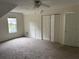 Bedroom with neutral carpet, ceiling fan, one window, and sloped ceilings at 6280 Autry Mill Rd, Cumming, GA 30028